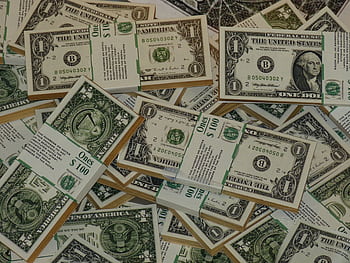 Numerous bundles of US one dollar bills symbolizing wealth, finance, and savings. HD wallpaper