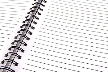 Open spiral notebook with lined pages, perfect for notes and planning. HD wallpaper