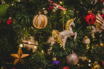Close-up of a beautifully decorated Christmas tree with various ornaments and twinkling lights. HD wallpaper