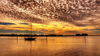 Golden Sunset, boat, sunlight, colors, peaceful, beauty, sailboats, reflection, boats, trees, ocean, sunset, golden, sea, beautiful, sailboat, view, clouds, sailing, nature, sky, lovely HD wallpaper