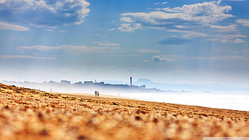 foggy beach from ground level, fog, lighthouse, clouds, people, beach HD wallpaper