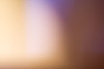 A soothing abstract blurred gradient background with warm tones. HD wallpaper