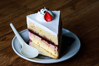 Indulge in this mouthwatering slice of strawberry cream cake, perfect for dessert lovers. HD wallpaper
