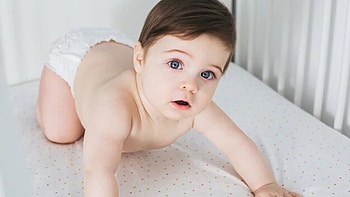 Adorable Cute Little Baby Boy Is Lying On Crib In White Wall Background Cute HD wallpaper