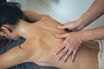 A soothing body massage session promoting wellness and relaxation in a spa setting. HD wallpaper