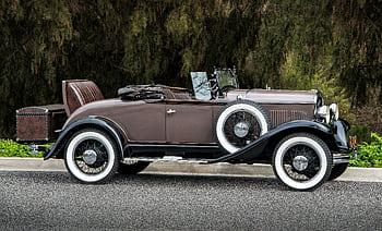 Classic brown convertible parked outdoors with vintage charm in Laguna Niguel, CA. HD wallpaper