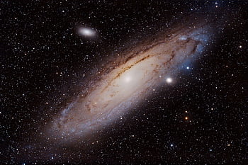 Mesmerizing shot of the Andromeda Galaxy showcasing its spiral form in the cosmos. HD wallpaper