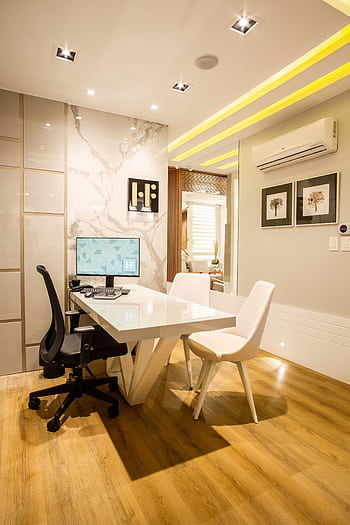 Elegant modern office interior featuring a sleek desk, chairs, and ambient lighting for a sophisticated environment. HD phone wallpaper