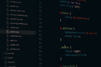 Close-up of colorful CSS code lines on a computer screen for web development. HD wallpaper