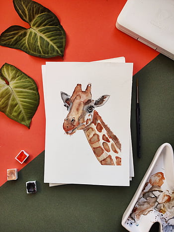 A watercolor painting of a giraffe surrounded by leaves and painting tools. HD phone wallpaper