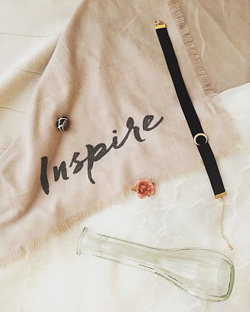 Stylish composition featuring fashion jewelry and decor items with inspiring text on fabric. HD phone wallpaper