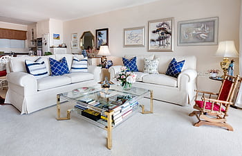 Modern living room with stylish decor and comfortable white sofas. HD wallpaper