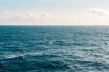 Tranquil ocean view under a clear sky, capturing the serene beauty of the expansive water. HD wallpaper