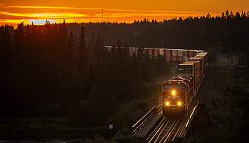 Twilight Freight — : Train Crossing Sunset Rails, railroad, train, nature, natural landscape, sunset HD wallpaper