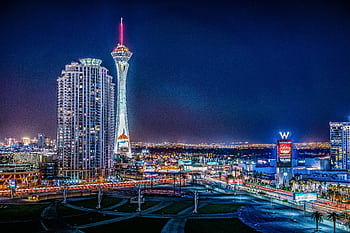 Illuminated Las Vegas skyline showcasing the vibrant nightlife and iconic Stratosphere Tower. HD wallpaper