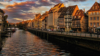 river through a lovely village at sundown, river, sundown, street, bridge, village HD wallpaper