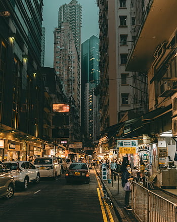 Discover the bustling nightlife and vibrant street scene of Kowloon, Hong Kong's busy shopping district. HD phone wallpaper