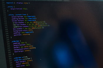 Close-up of CSS code displayed on a computer monitor, showcasing web development. HD wallpaper