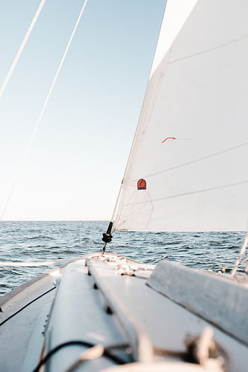 Tranquil view from a sailboat on open water in Norfolk, VA, under clear skies. HD phone wallpaper
