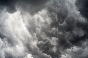 A striking monochrome of dramatic dark clouds forming a moody sky. HD wallpaper