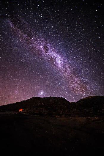 Beautiful star-filled sky with Milky Way over mountains in La Pampa, Argentina. HD phone wallpaper