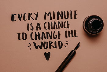 A motivational quote handwritten with a fountain pen, inspiring change and positivity. HD wallpaper