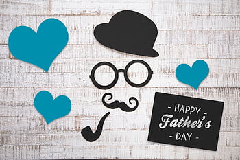 Charming Father's Day card with vintage elements on a wooden background, perfect for celebrating dads. HD wallpaper