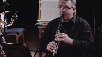 Paul Cigan's clarinet, Jon Deaks composition, Scrooge's musical journey, Emotional performances HD wallpaper