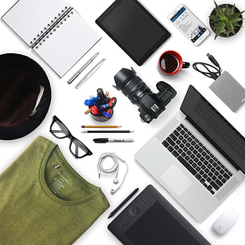 Top view of a creative workspace with camera, laptop, and accessories, perfect for a designer or grapher. HD phone wallpaper