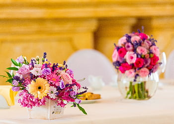 A beautiful bouquet of pastel flowers on a table, perfect for weddings or romantic occasions. HD wallpaper