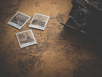 Vintage style still life with a camera, map, and travel . Perfect for travel enthusiasts. HD wallpaper