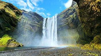 Skogafoss in Iceland, river, trees, clouds, sky, cliff, rocks HD wallpaper