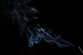 Abstract wisps of smoke in graceful motion on a dark background. HD wallpaper