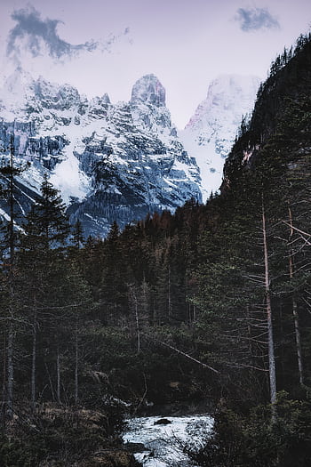 Tranquil snowy mountains and forest creek creating a peaceful winter landscape. HD phone wallpaper