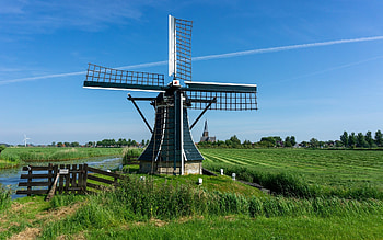 Windmill in Netherlands, wooden, windmill, fields, church, Netherlands HD wallpaper