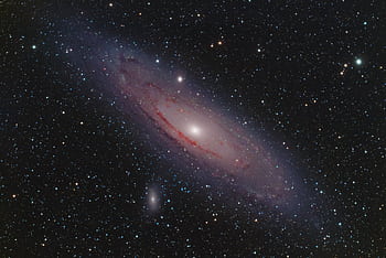 A captivating view of the Andromeda Galaxy surrounded by stars in the vast cosmos. HD wallpaper