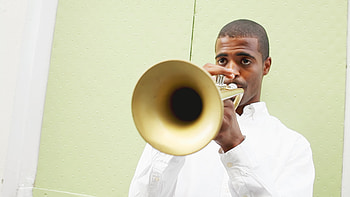 Black man playing trumpet, Outdoor performance HD wallpaper