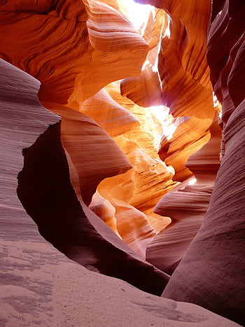 Stunning view of Antelope Canyon with vibrant sunlit rock formations showcasing natural beauty. HD phone wallpaper