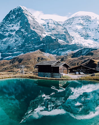 Breathtaking view of the Swiss Alps reflecting in a tranquil lake near Sachseln. HD phone wallpaper
