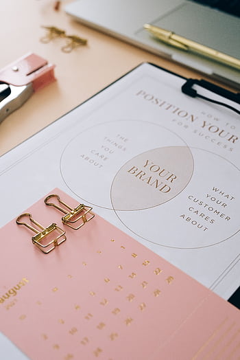Organize your brand strategy with this detailed clipboard layout showcasing planning and positioning. HD phone wallpaper