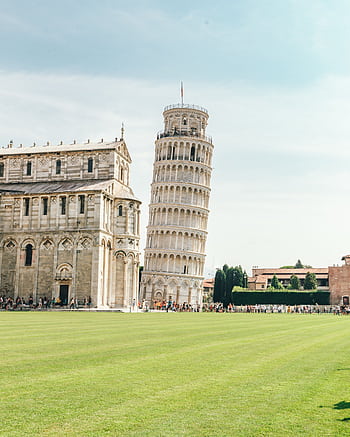 The iconic Leaning Tower of Pisa and adjacent cathedral in a sunny setting. HD phone wallpaper