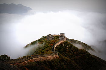 Majestic aerial shot of the Great Wall of China surrounded by mist and mountains. HD wallpaper