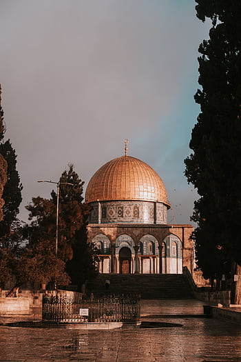 A serene view of the Dome of the Rock, Jerusalem at sunset, reflecting historical Islamic architecture. HD phone wallpaper