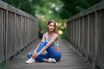 Blue torn jeans, sit, bridge, girl model HD wallpaper