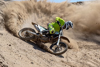 Thrilling dirt bike action in Cape Town's desert landscape. High-speed motocross adventure captured. HD wallpaper