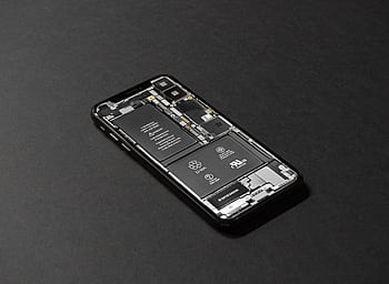 High-resolution of a smart showcasing its internal components on a dark surface. HD wallpaper