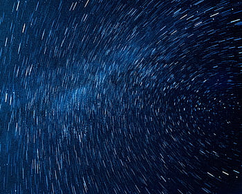 Captivating view of rotating star trails in a clear night sky, captured from Pont-a-Celles, Belgium. HD wallpaper