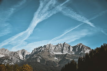Breathtaking view of Wilder Kaiser mountains in Tirol, Austria with clear skies, an excellent travel destination. HD wallpaper