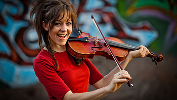 Lindsey Stirling, Musician extraordinaire, Energetic stage presence, Stunning visuals HD wallpaper