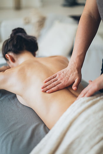 A calming massage session focusing on relaxation and wellness, perfect for stress relief. HD phone wallpaper